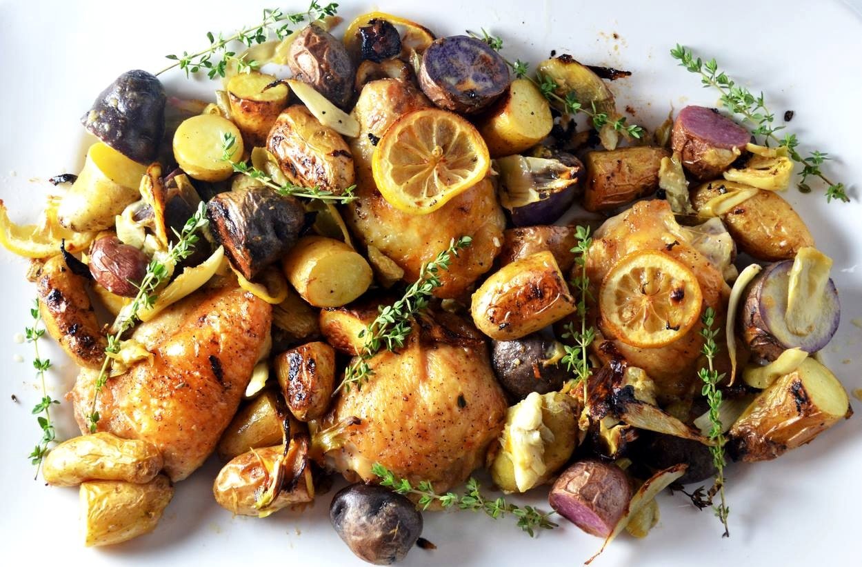 Roast chicken with lemon, thyme and potatoes